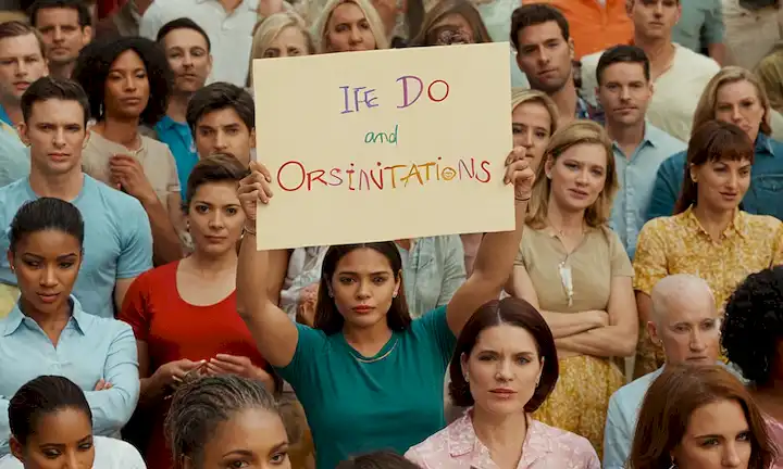 Mujer que sostiene una lectura de signos Final a la discriminación de orientación sexual y rodeada de personas de diversas orientaciones sexuales. El acrónimo LGBTTI+, la etiqueta para personas lesbianas, gays, bisexuales, terminal homosexuales (o fluidos) más identidades queer, se utiliza en este contexto. La frase también se expande más allá de las parejas hermafroditas o plenamente realizadas del mismo sexo para abarcar una variedad de relaciones y experiencias.