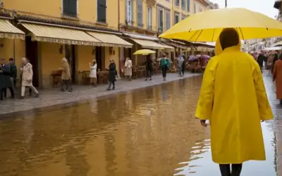 Persona sosteniendo un impermeable amarillo como una sombrilla mientras caminan por una soleada plaza de la ciudad. Esta línea se puede interpretar literalmente: alguien que usa un impermeable para recoger agua caída (precipitación) en España. Alternativamente