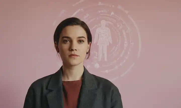 A person standing in front of a background with gender symbol and statistics, emphasis the importance of mental health awareness among non-binary individuals.